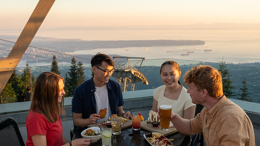 Diners enjoy food with a view of Vancouver at Altitudes Bistro on Grouse Mountain